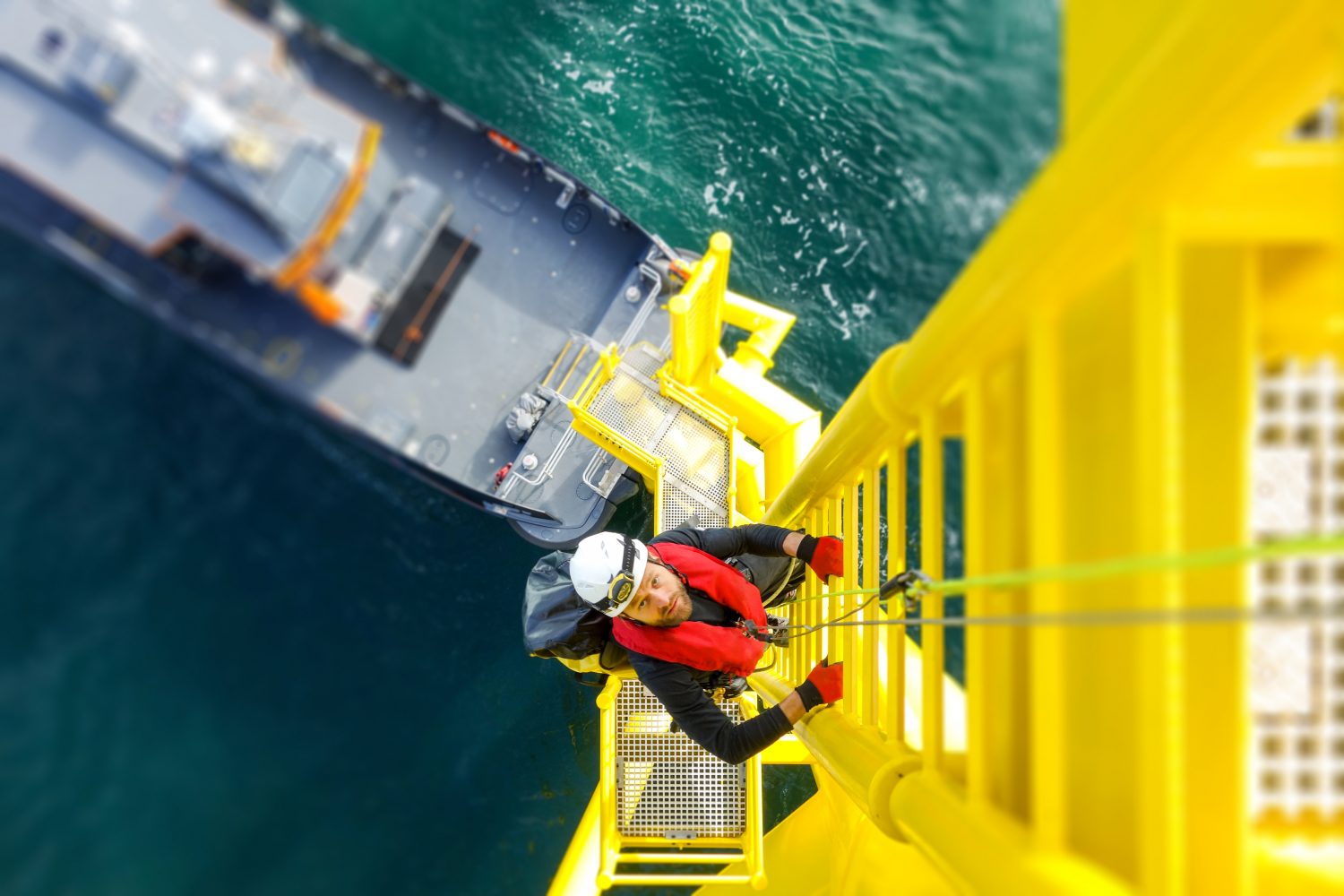 Wind-turbine, offshore, worker, climbing, high up, boat, sea