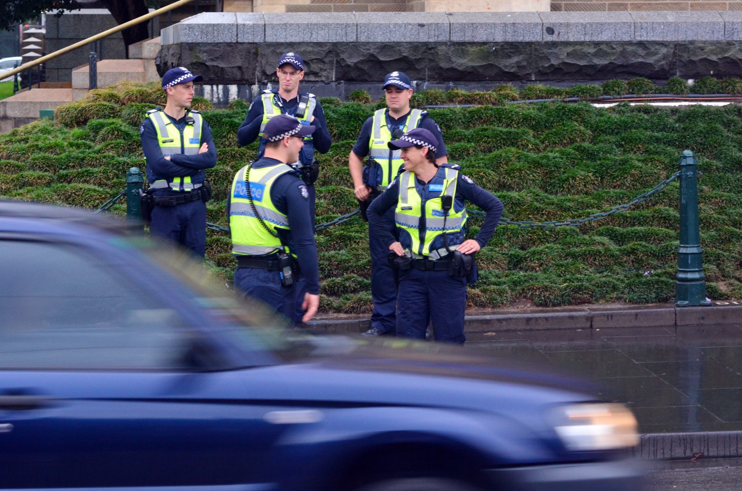 Melbourne, Australia - April 10, 2014: Victoria Policemen patrol Melbourne streets. As of 2013, Victoria Police has over 12,539 sworn members across 325 police stations. It has a running cost of aprox. 2. 1b $AUD (A$372 per resident).
